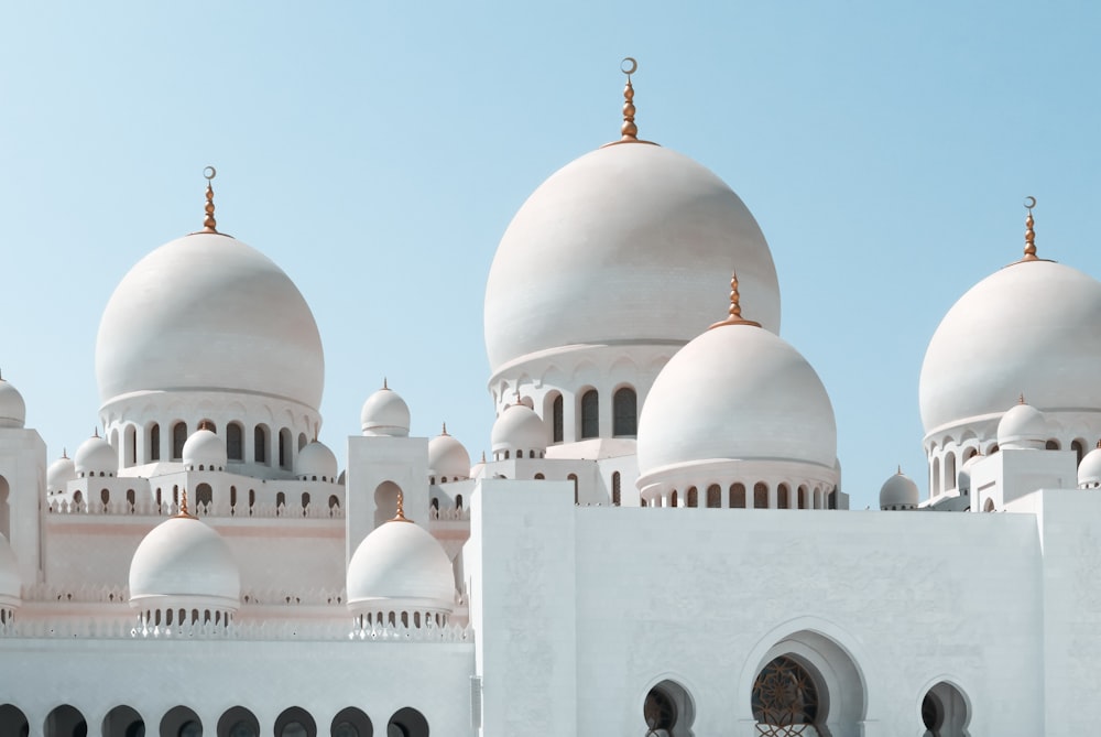 a large white building with many domes on top of it