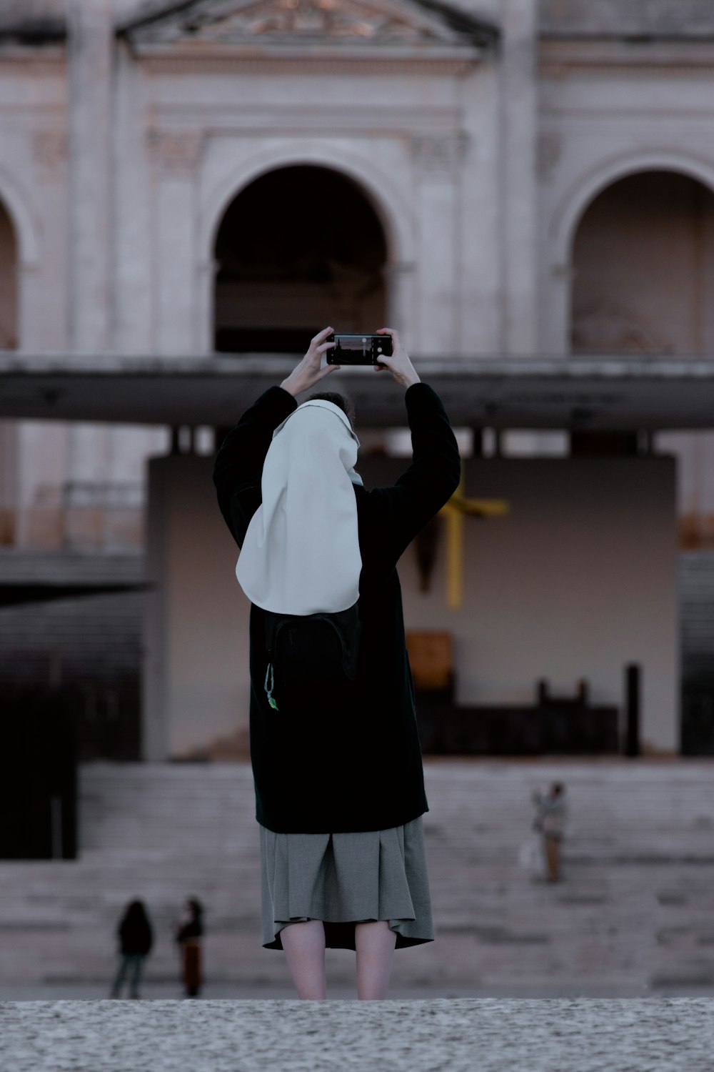 a person taking a picture of a building with a camera