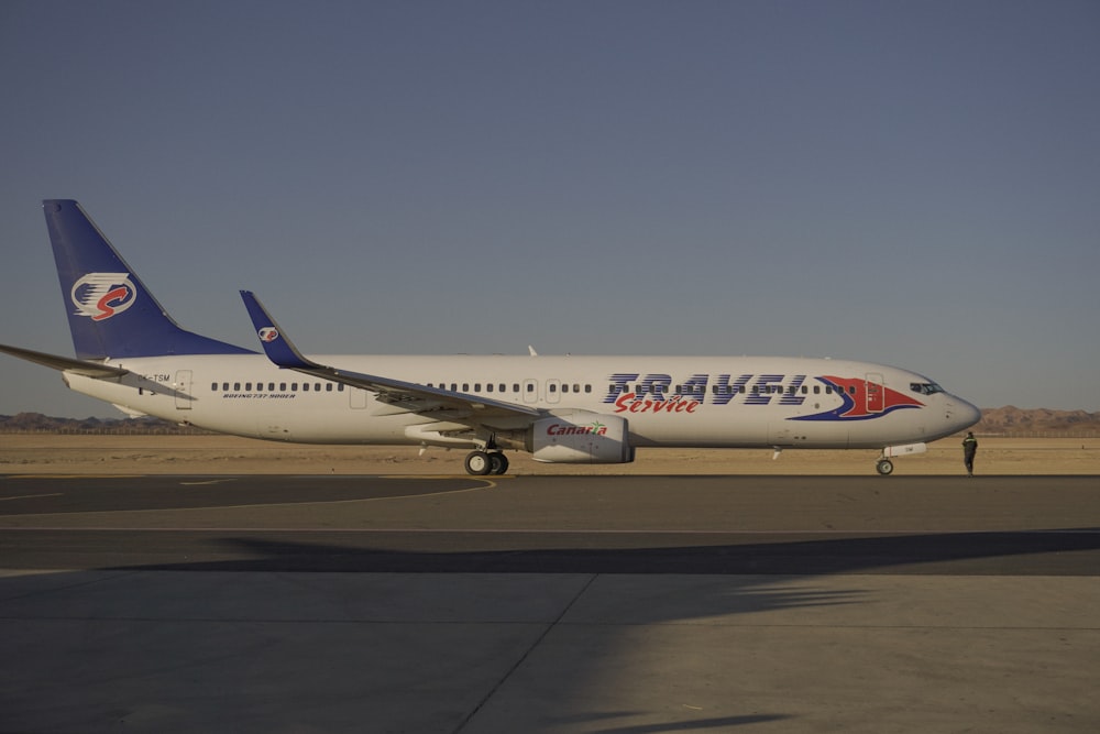 a large jetliner sitting on top of an airport tarmac