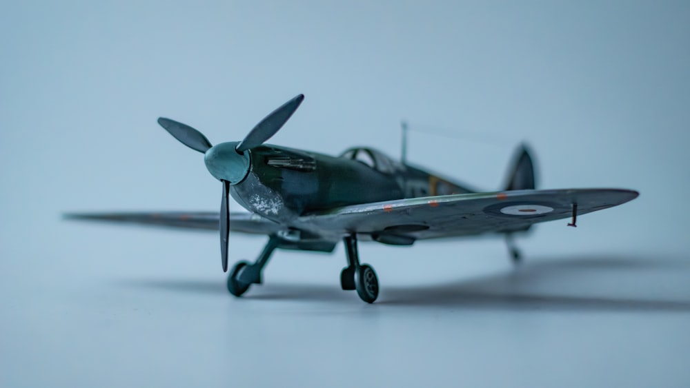a small model airplane sitting on top of a table
