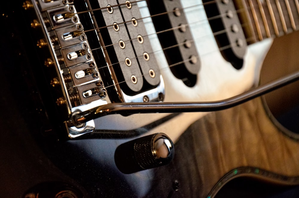 a close up of an electric guitar with a microphone
