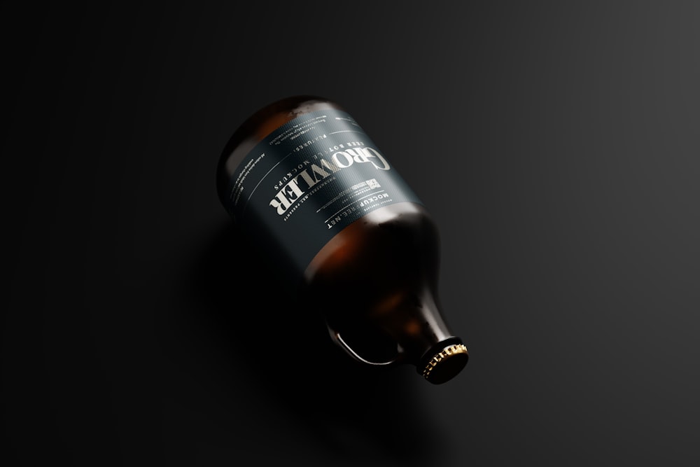 a bottle of beer on a black background