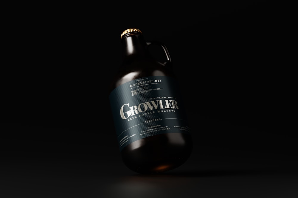 a bottle of growl beer on a black background