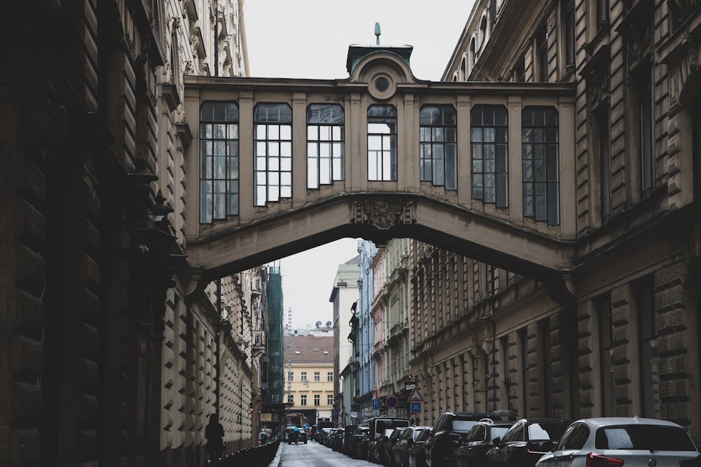 a city street with a bridge over it