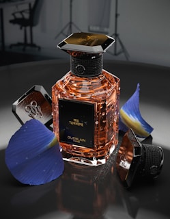 a bottle of perfume sitting on top of a table