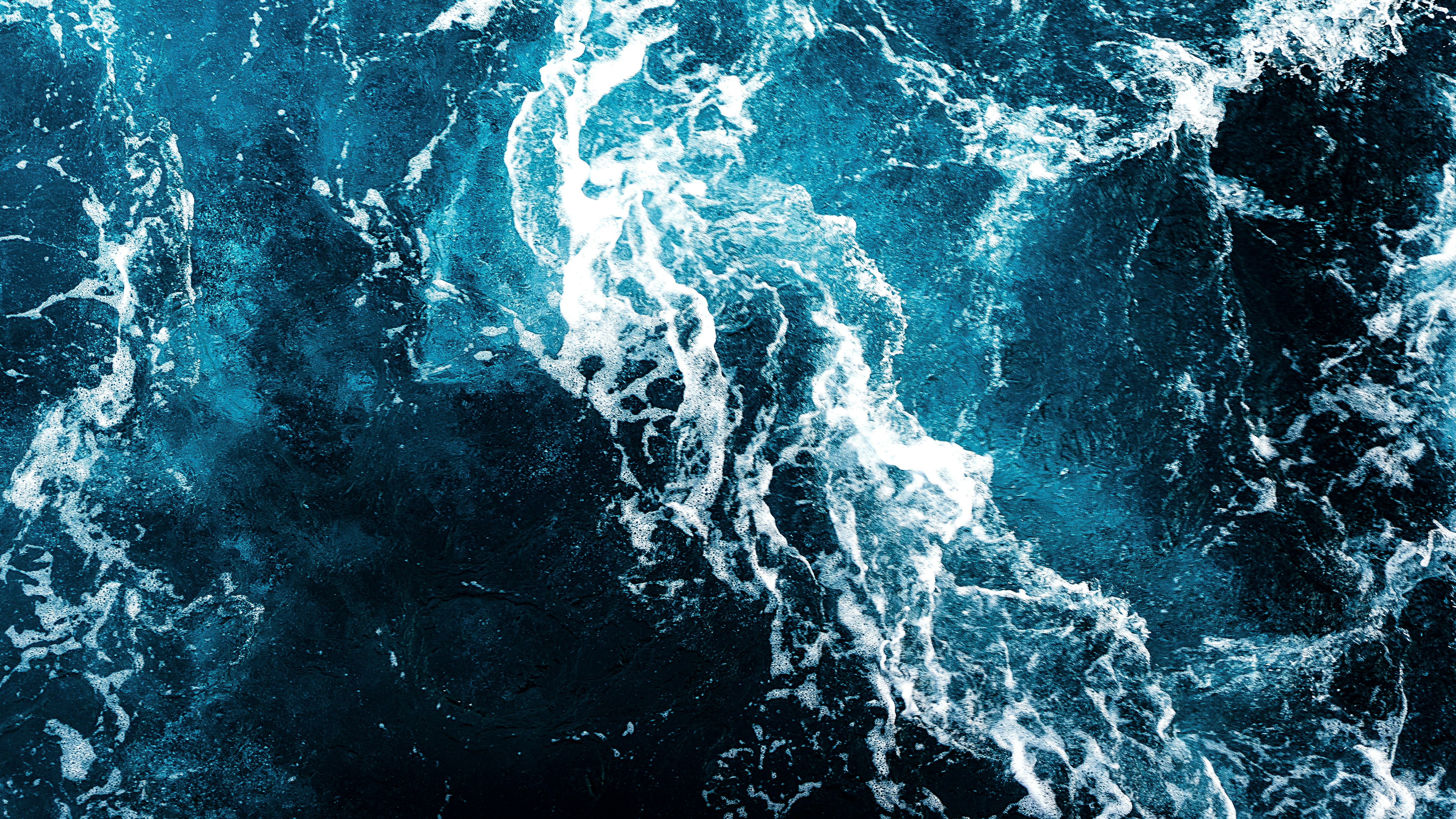 a large body of water covered in lots of blue water