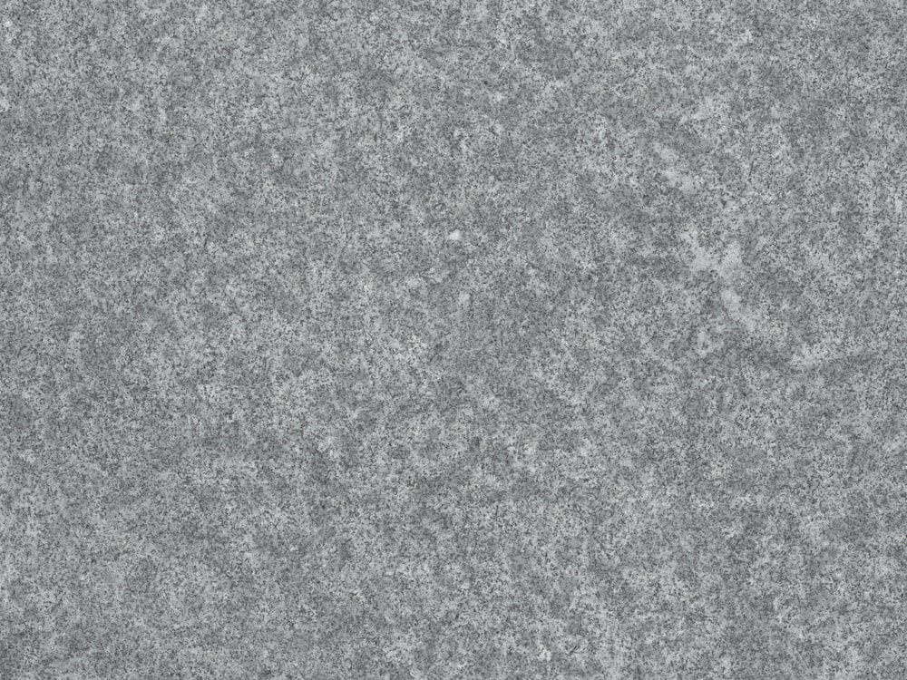 a close up of a gray granite surface