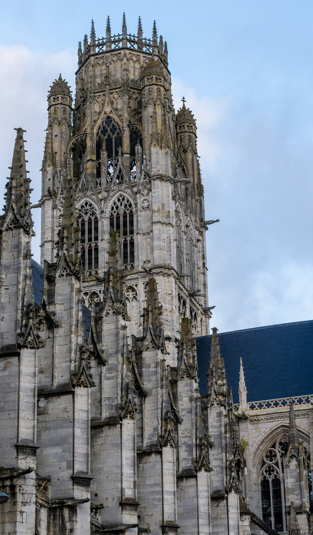 a very tall building with a clock on it's side