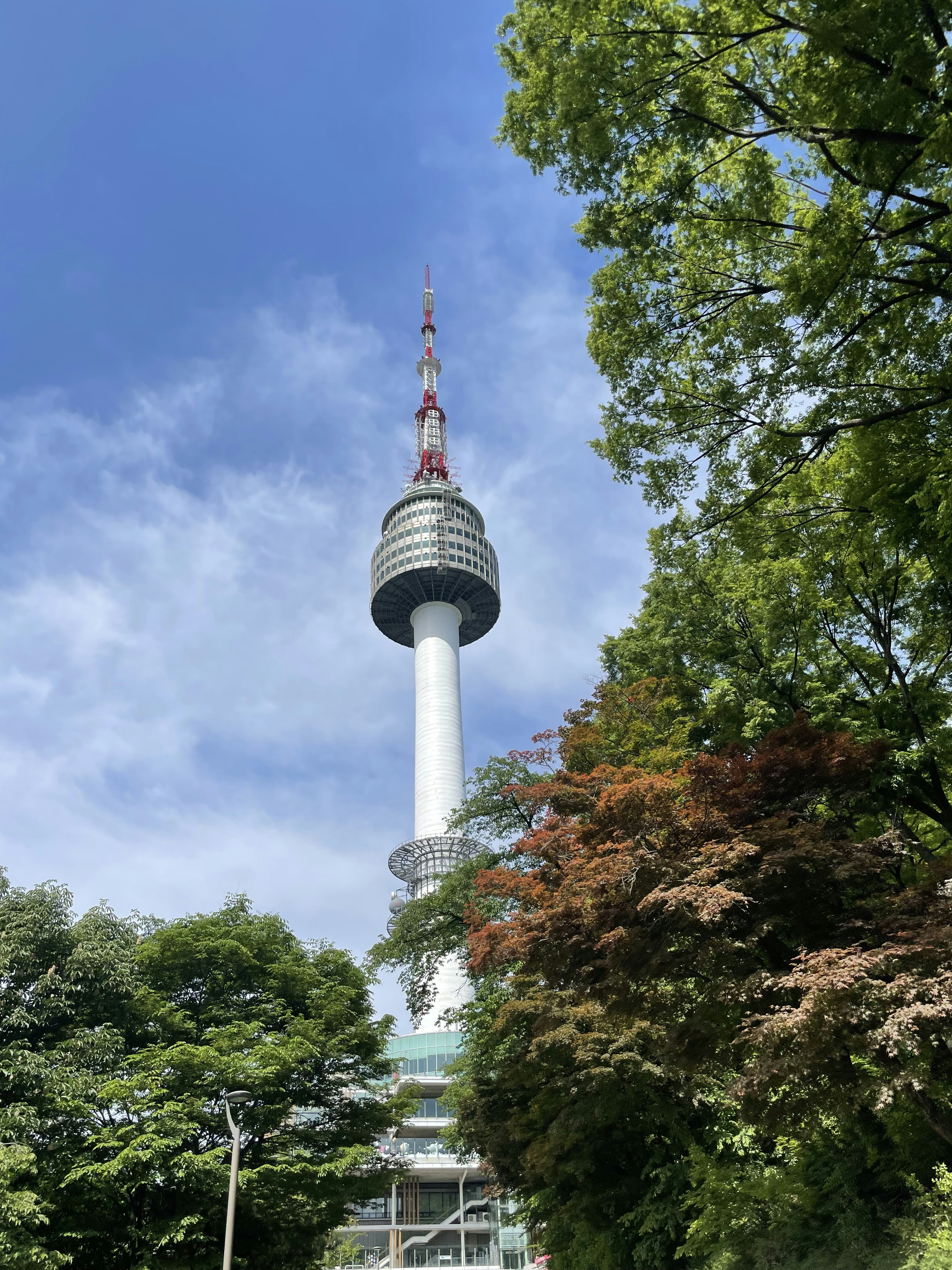 a tall white tower with a sky background