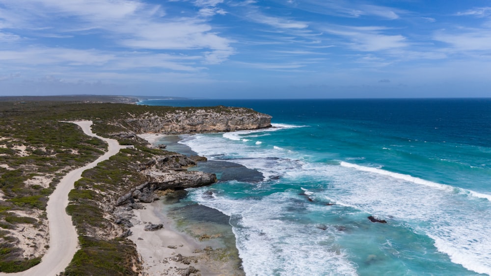 an aerial view of a beach and ocean