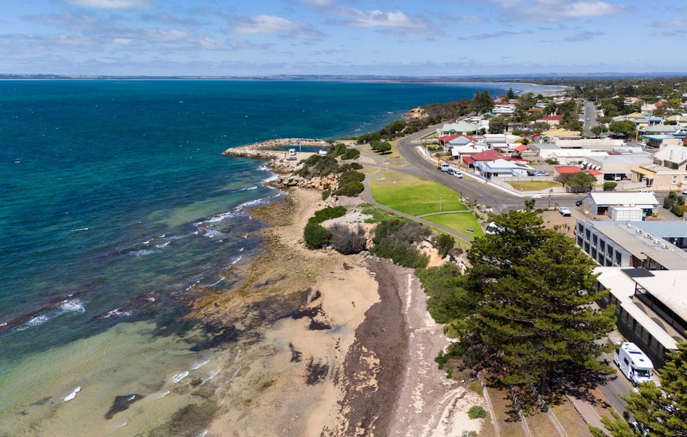 an aerial view of a beach and a city