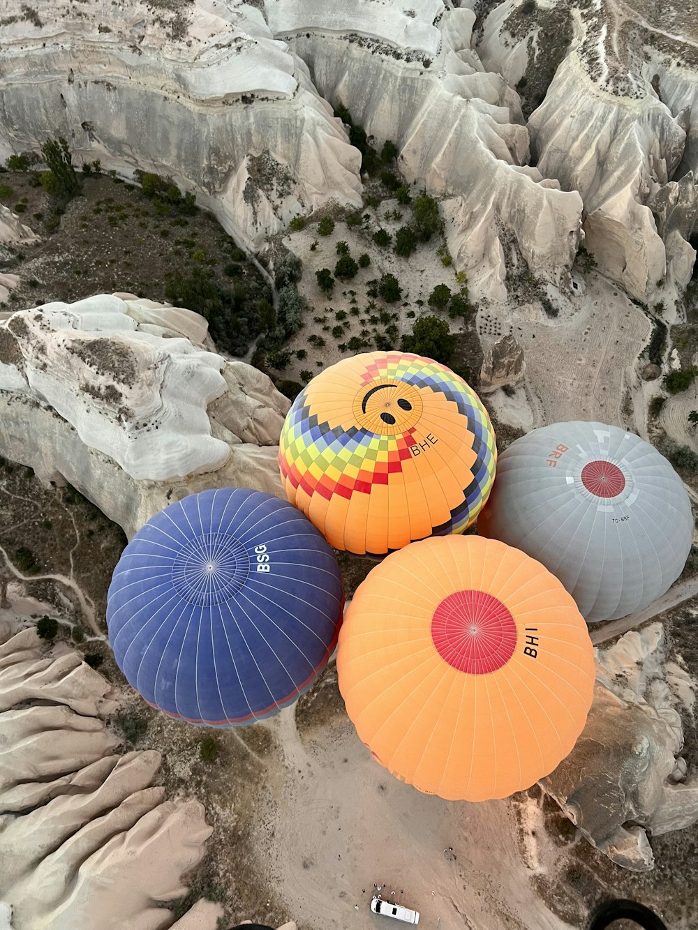 a group of colorful umbrellas sitting on top of a mountain