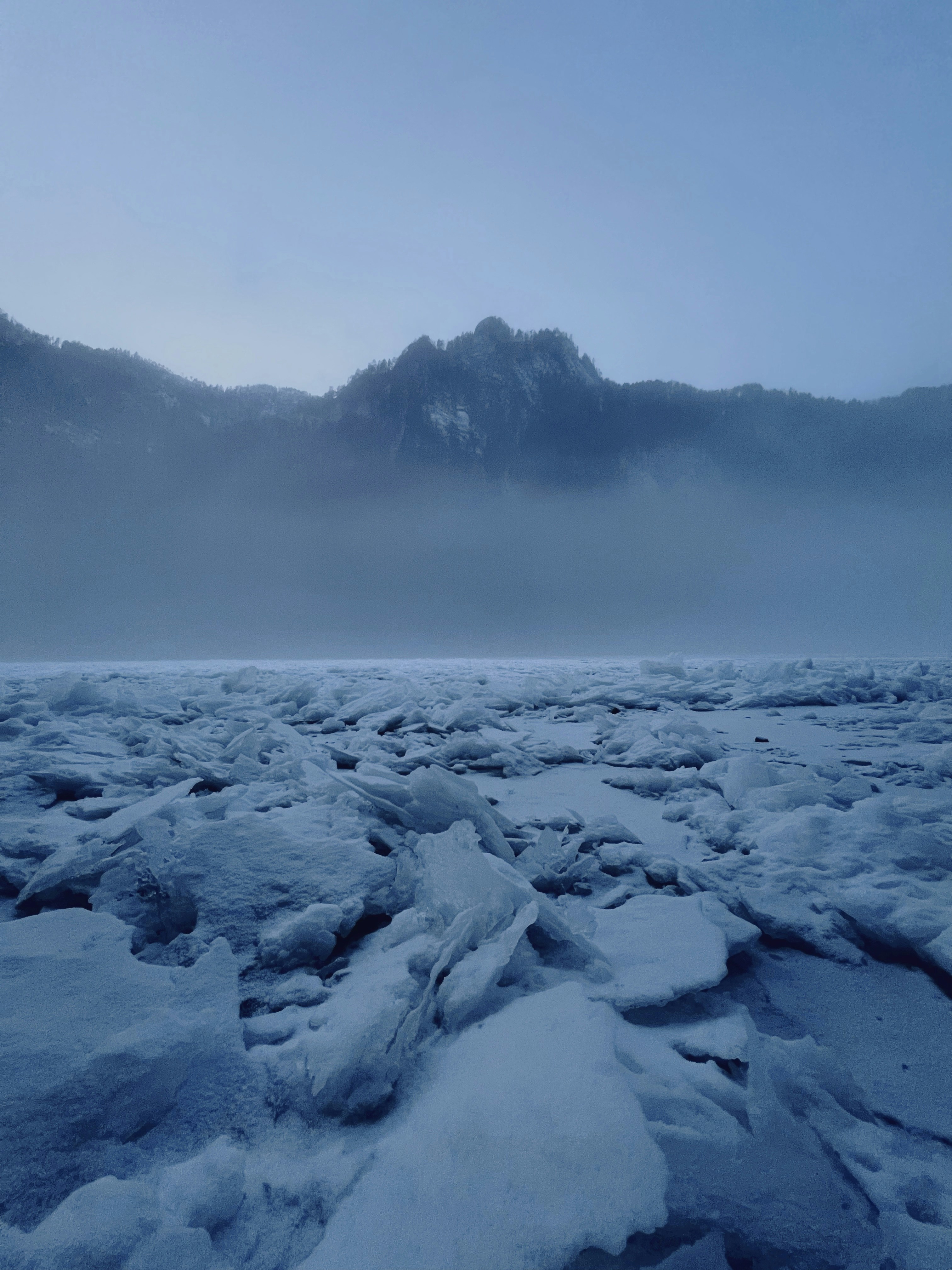 a view of a mountain range covered in snow