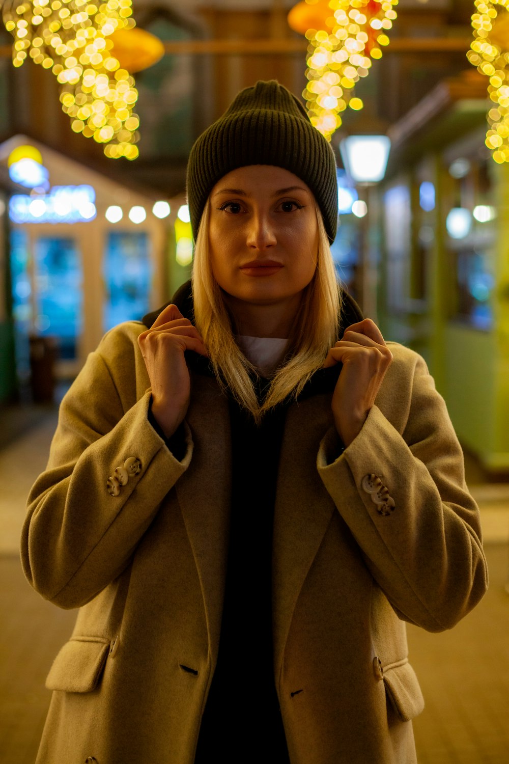 a woman in a coat and a beanie