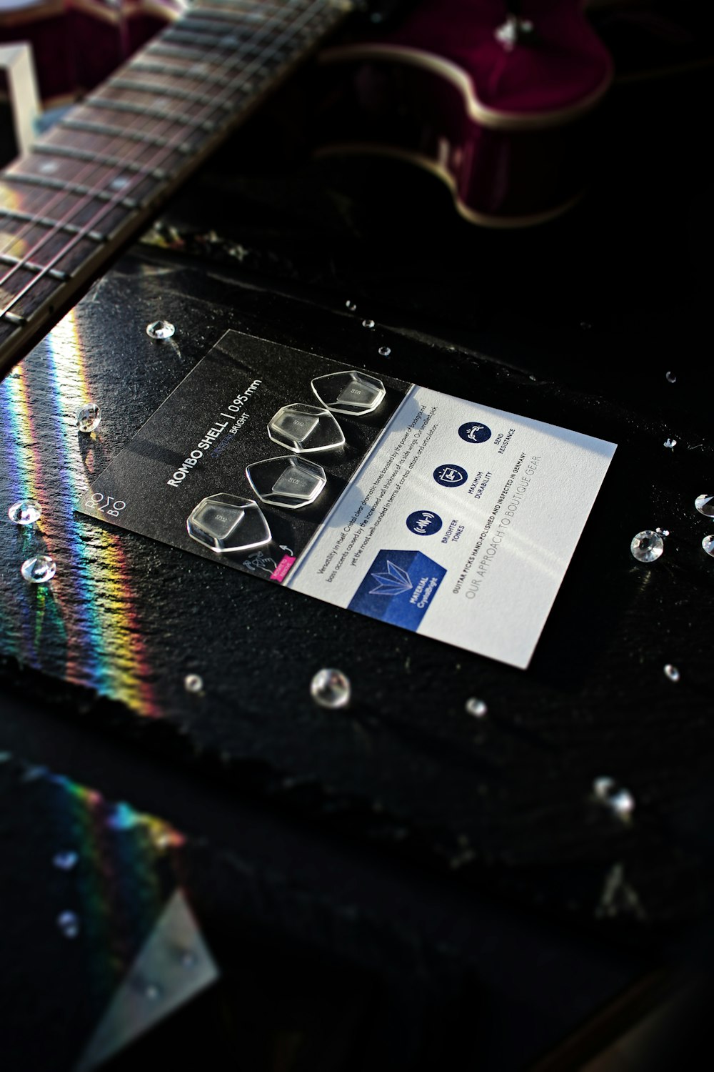 a close up of a business card on a guitar