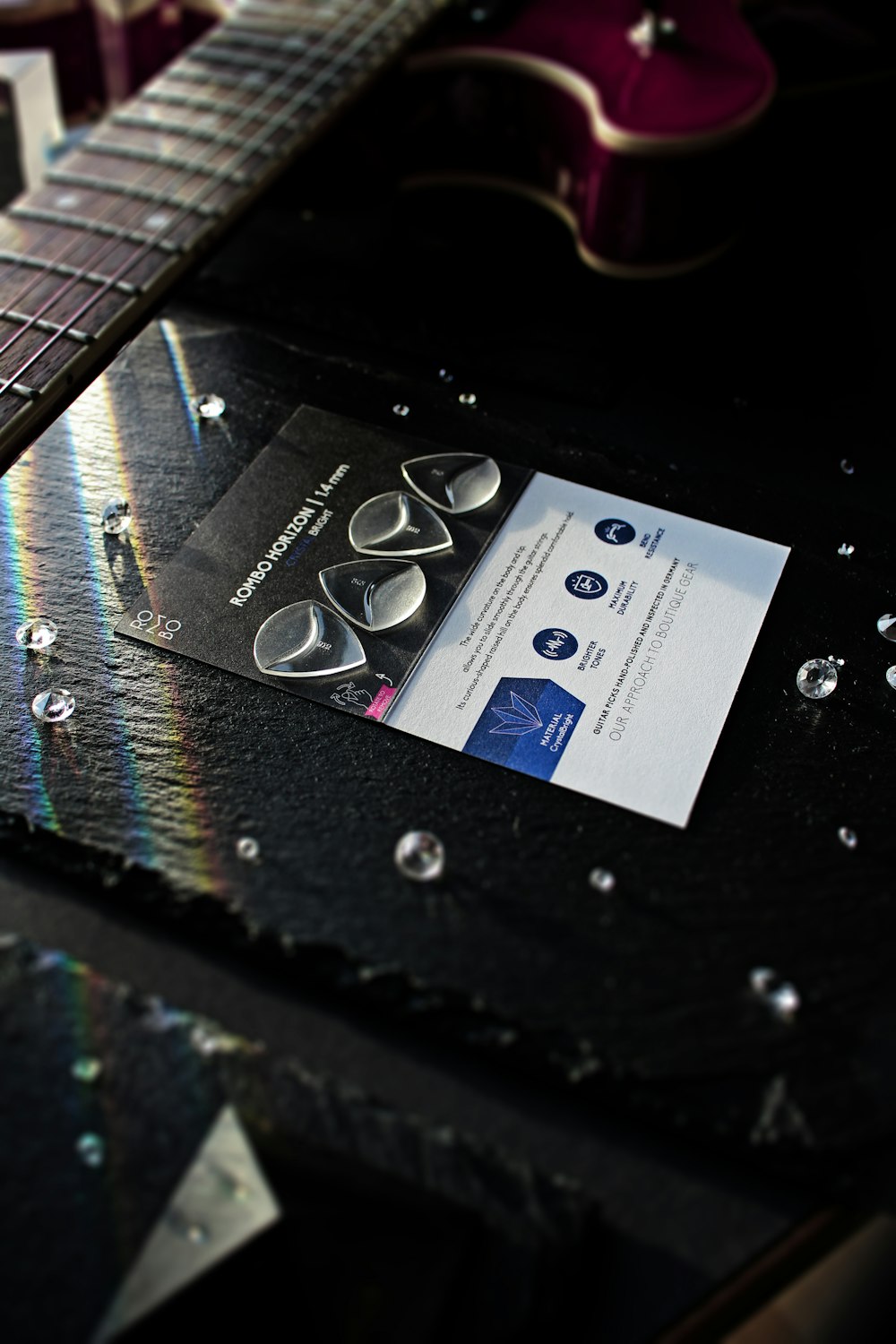 a close up of a business card on a guitar