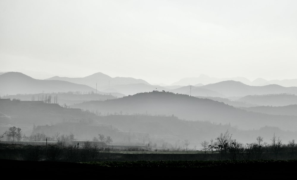 a black and white photo of a mountain range