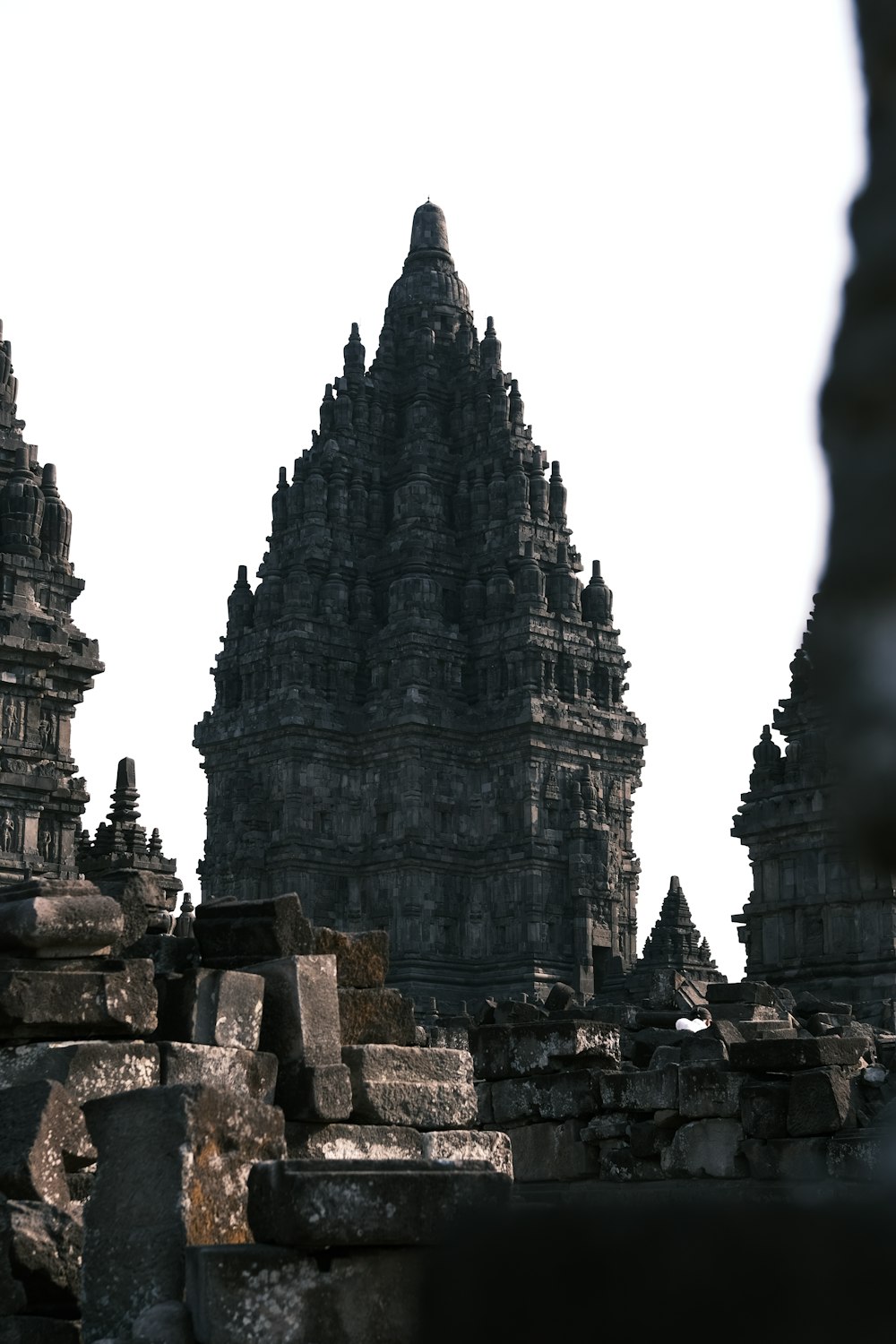 a group of stone structures with a sky background