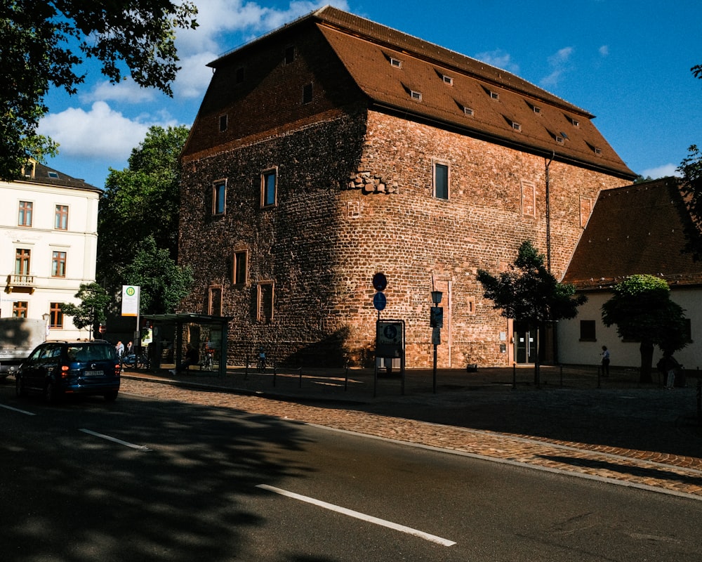 a large brick building sitting on the side of a road