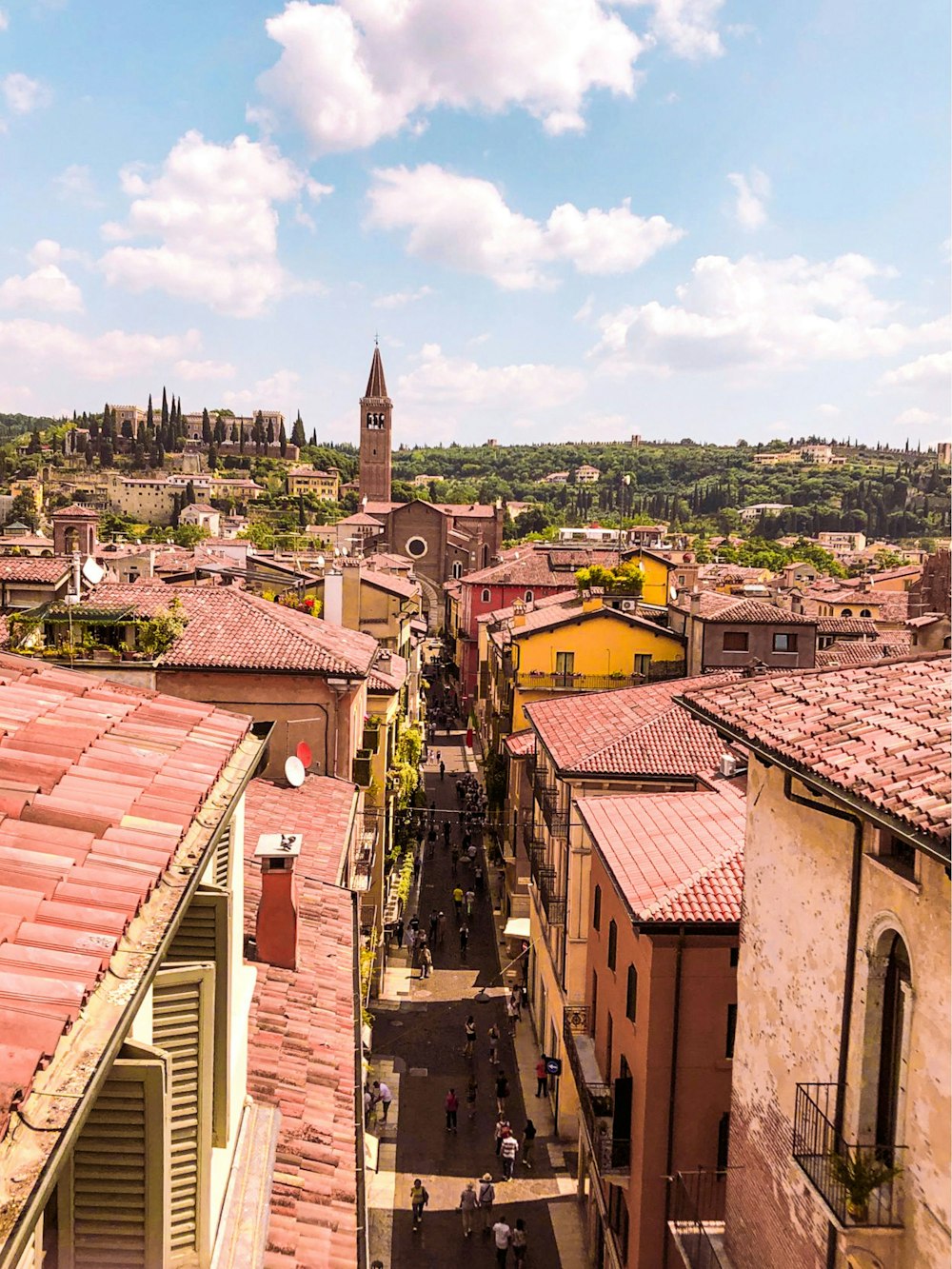 a view of a city with a clock tower in the background