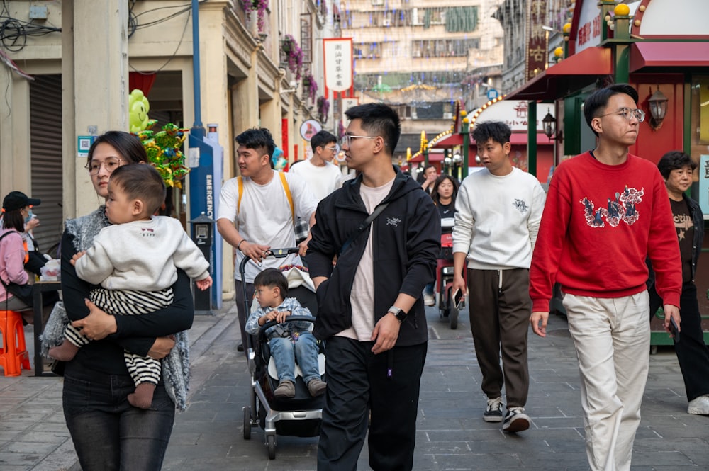 a group of people walking down a street