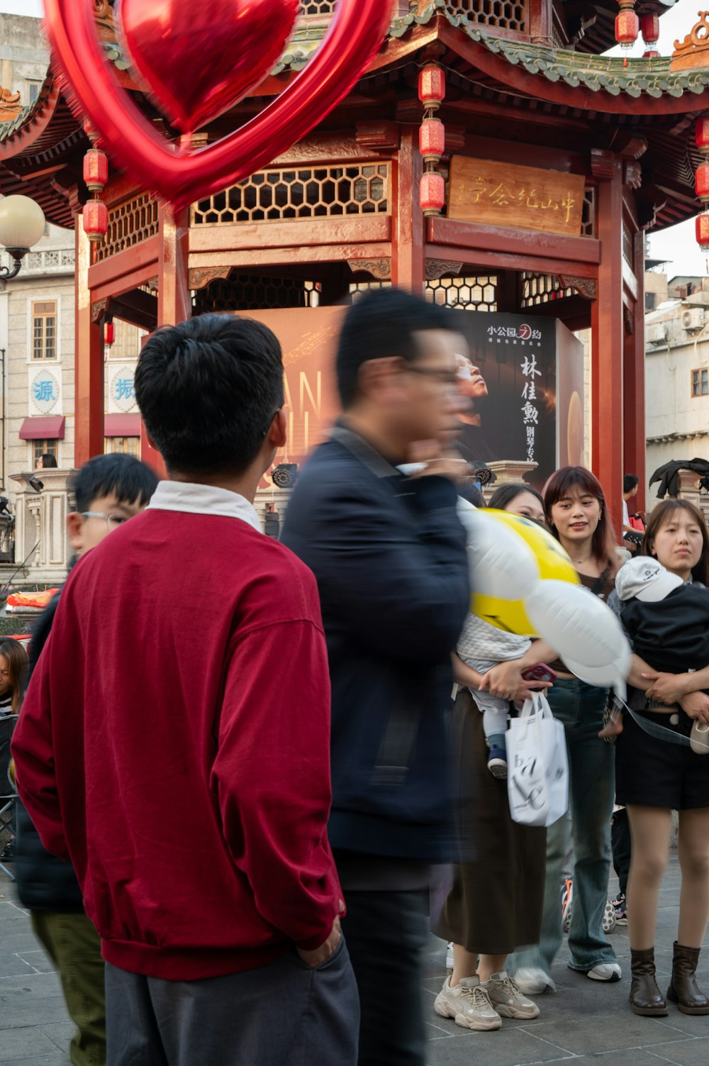 a group of people standing in front of a building