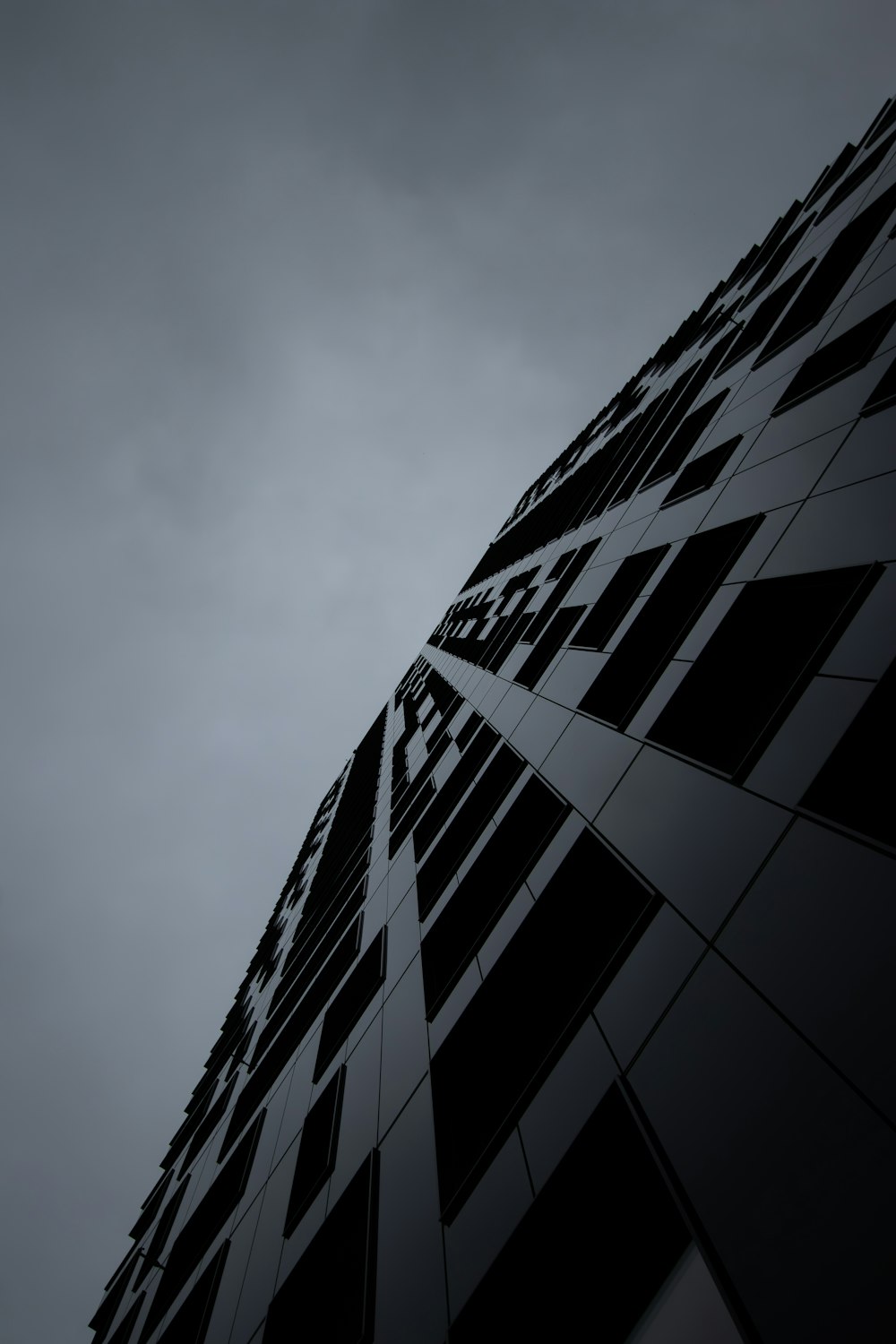 a very tall building with a sky in the background