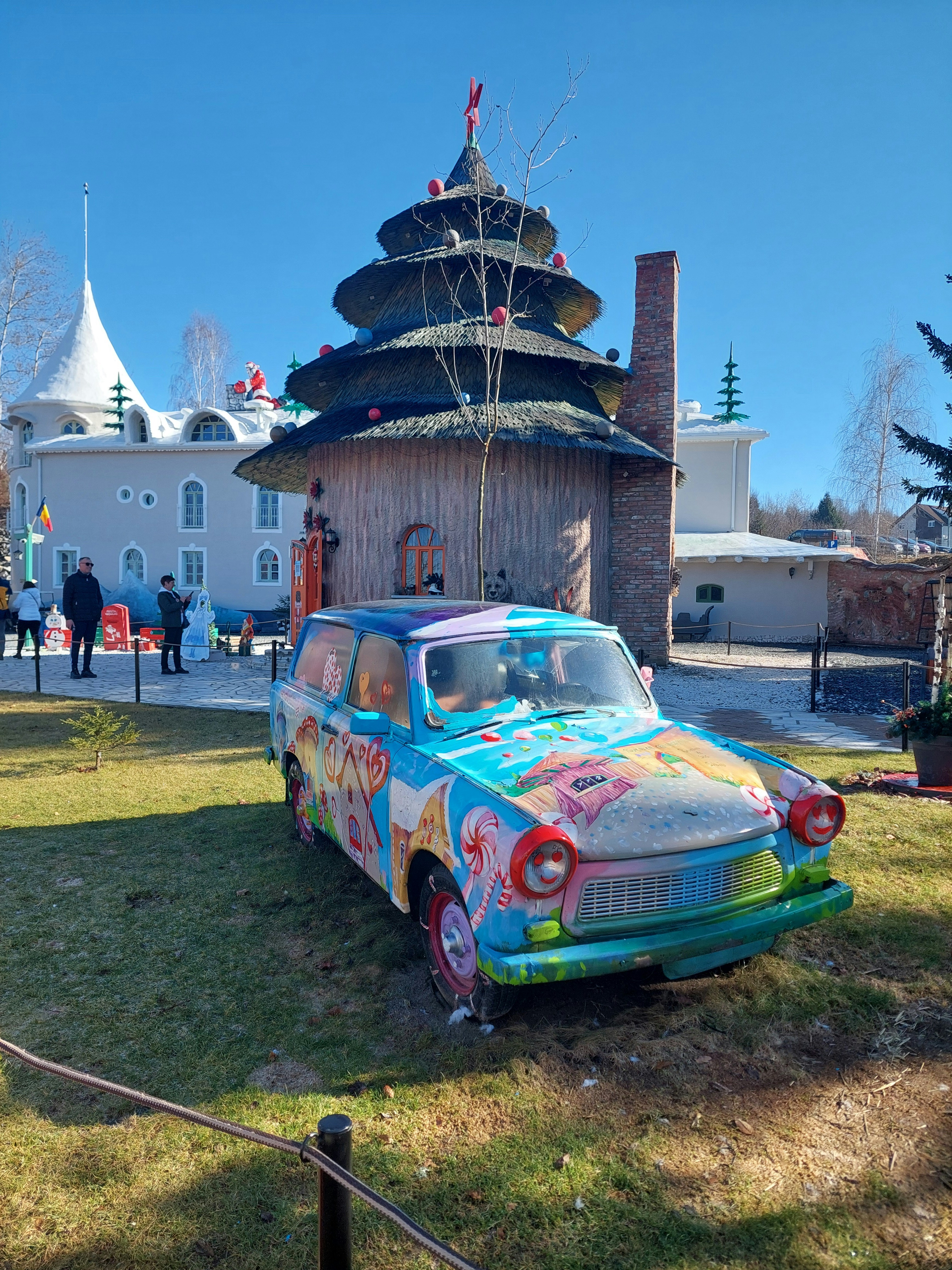 a colorful car parked in front of a building