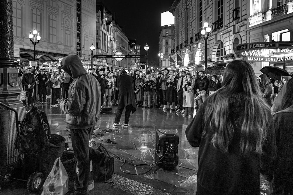 a black and white photo of a crowd of people