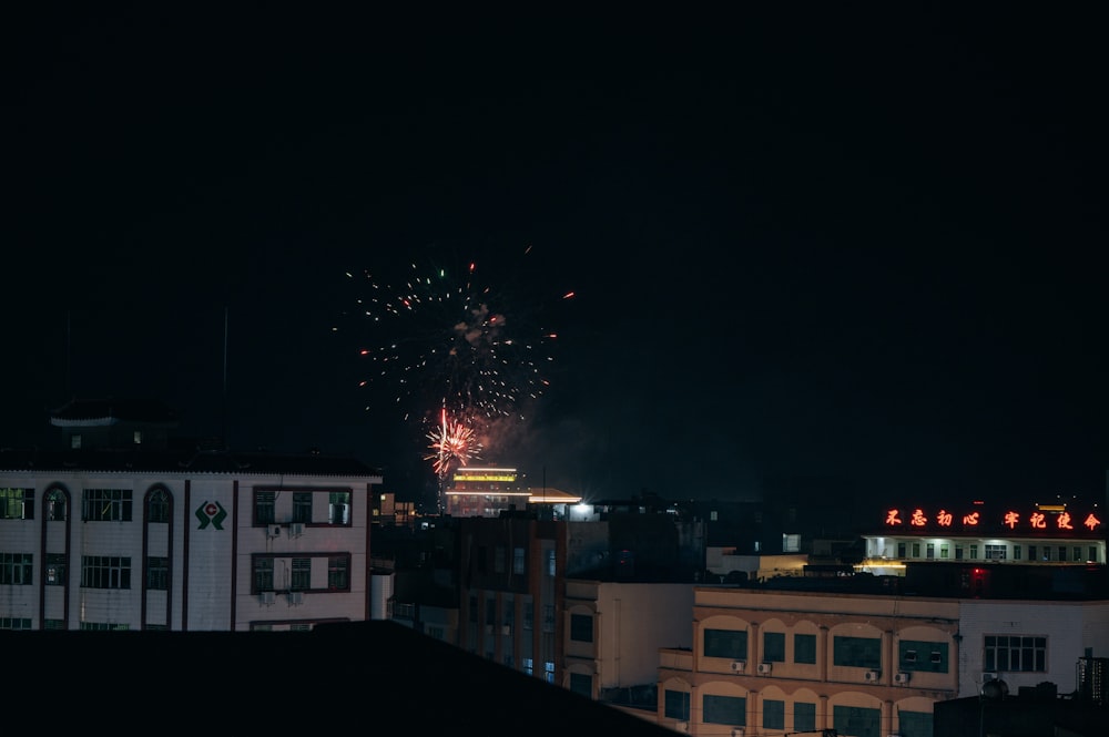fireworks in the sky over a city at night