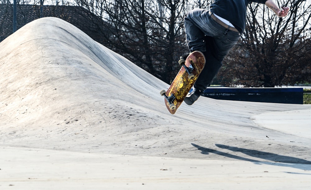 a man riding a skateboard up the side of a ramp