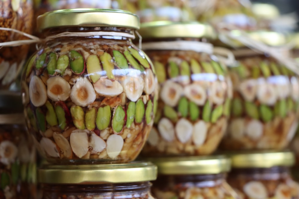 jars filled with food sitting next to each other