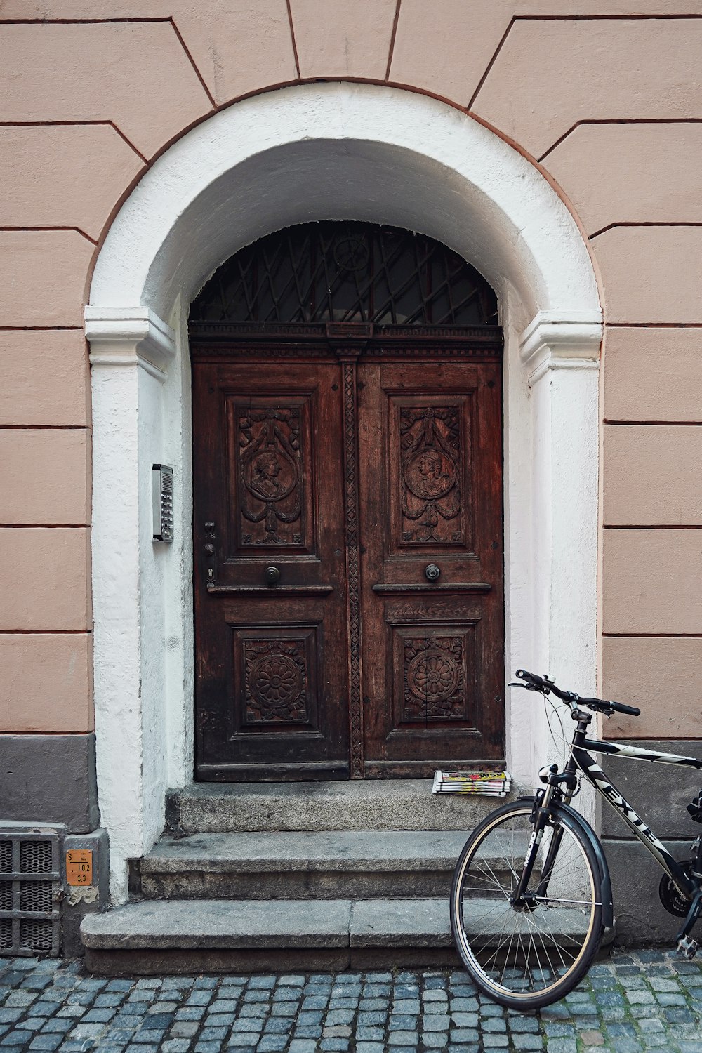 a bicycle is parked in front of a door