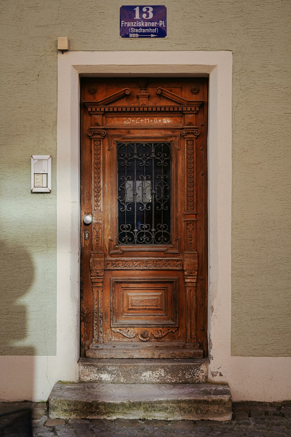 a wooden door with a sign above it