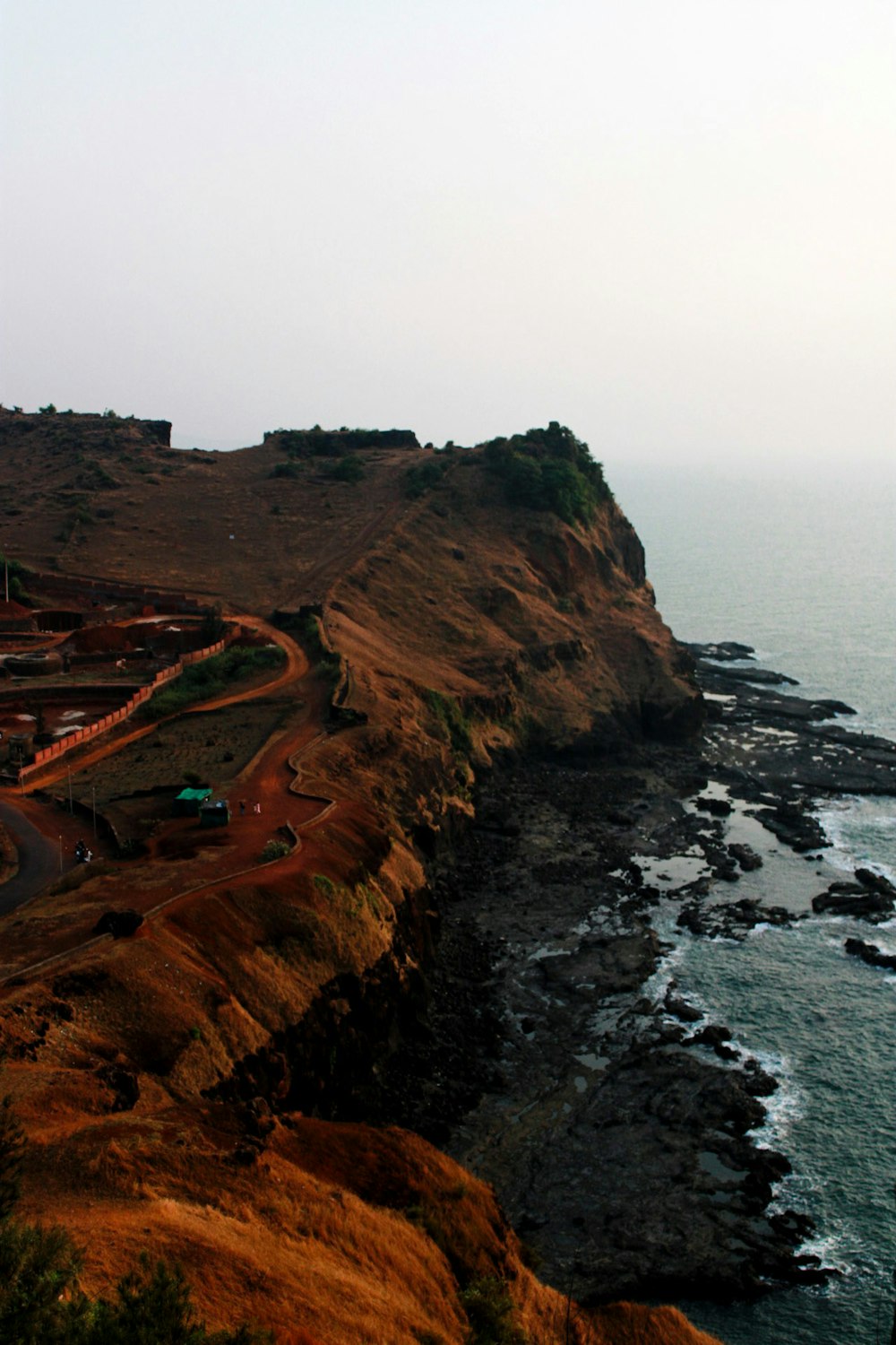 a scenic view of the ocean and a road