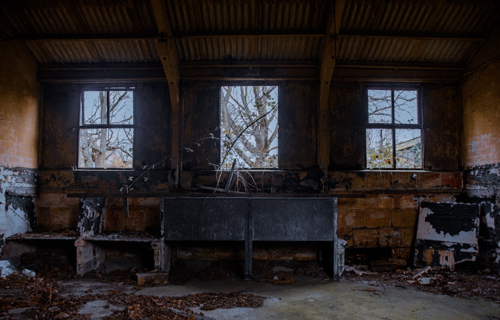 an old room with a broken piano in it