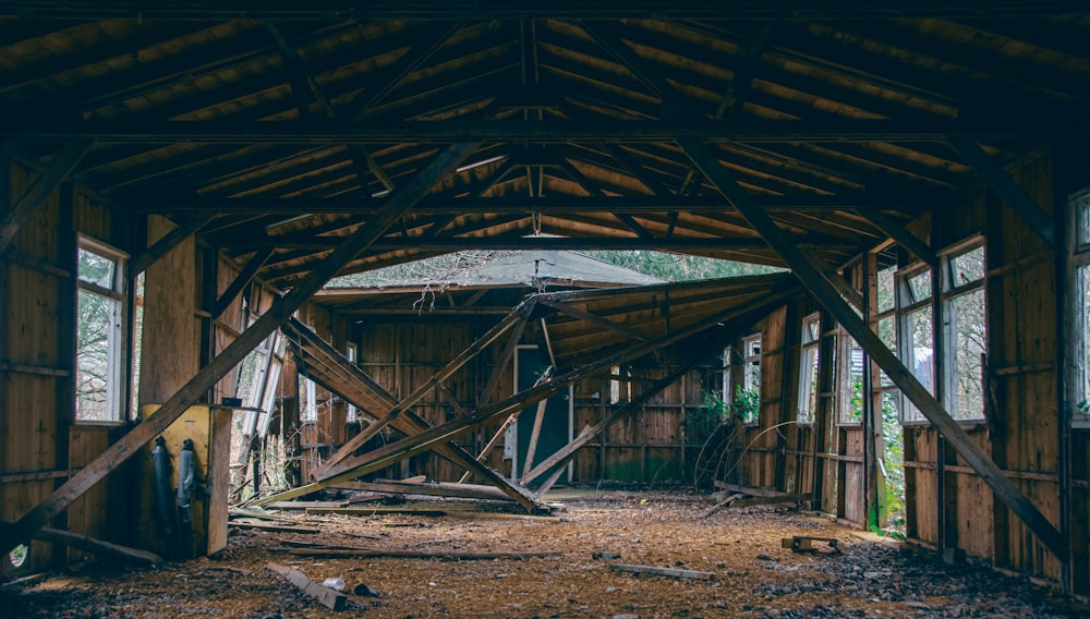 an old barn with wooden beams and windows