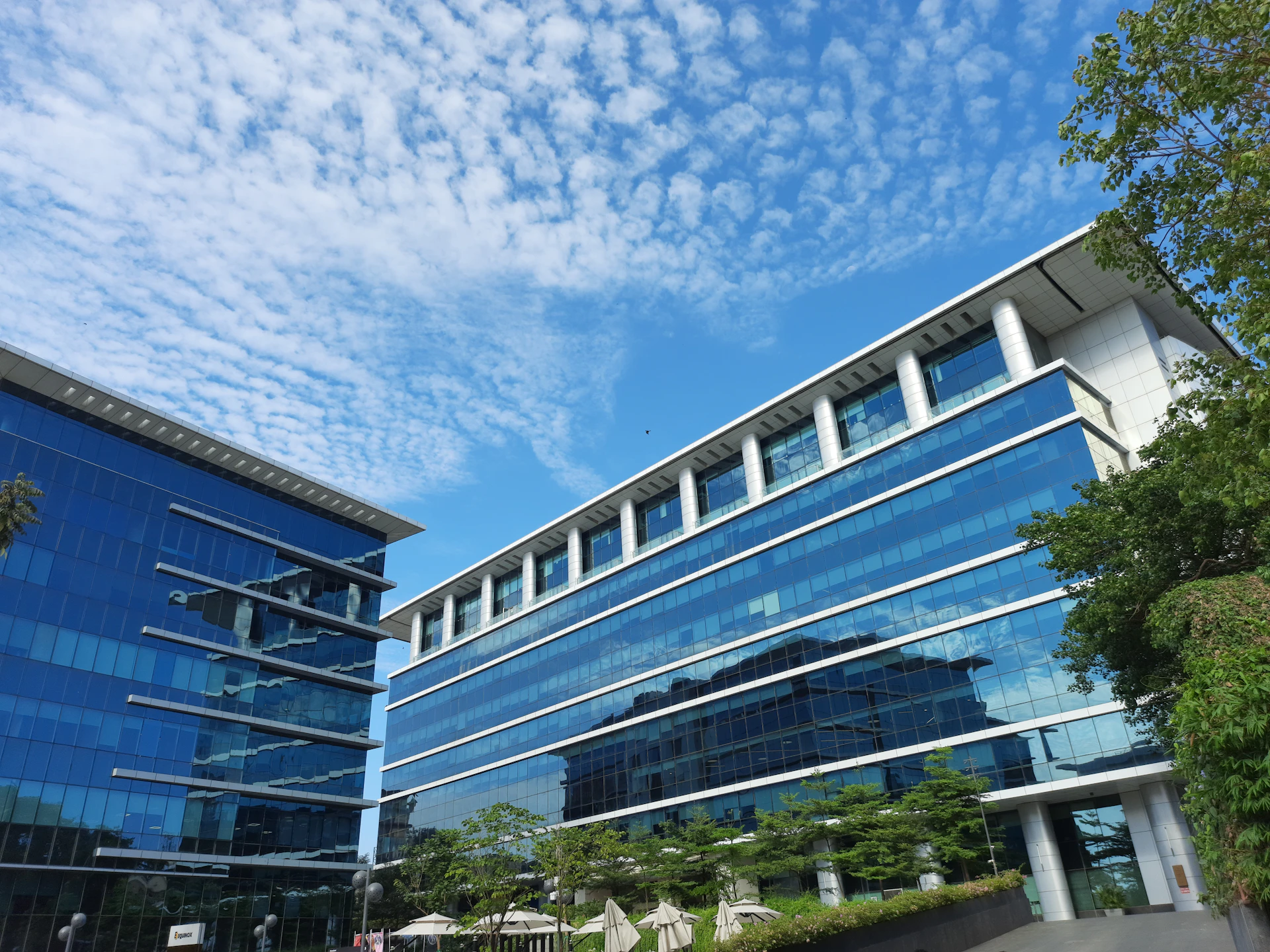 a building with a lot of windows and a sky background