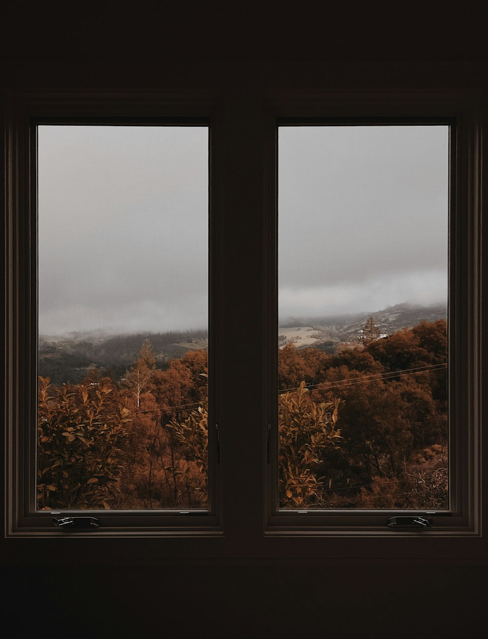 a window with a view of the mountains outside