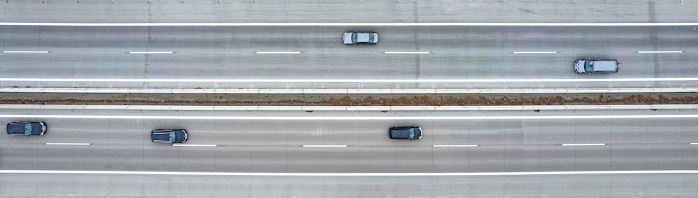 an overhead view of three lanes of a highway