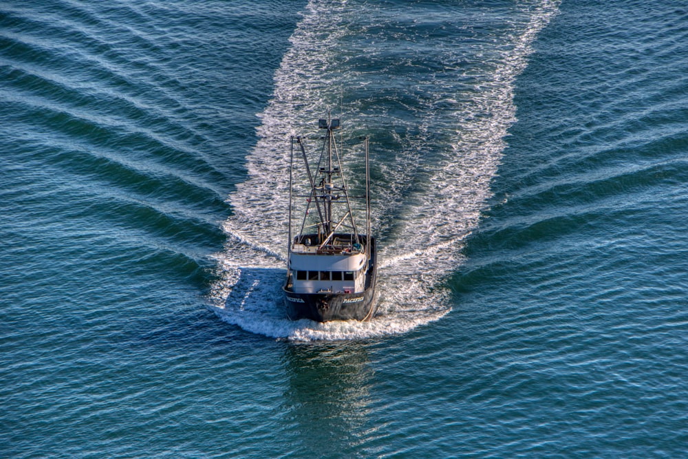 a boat traveling across a body of water