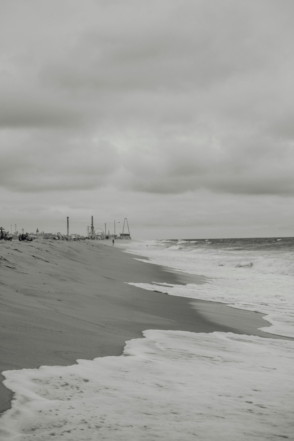 a black and white photo of a beach