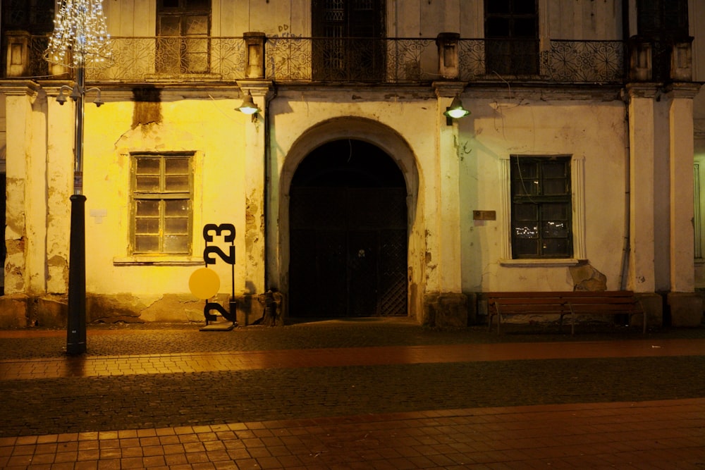 an old building with a bench in front of it