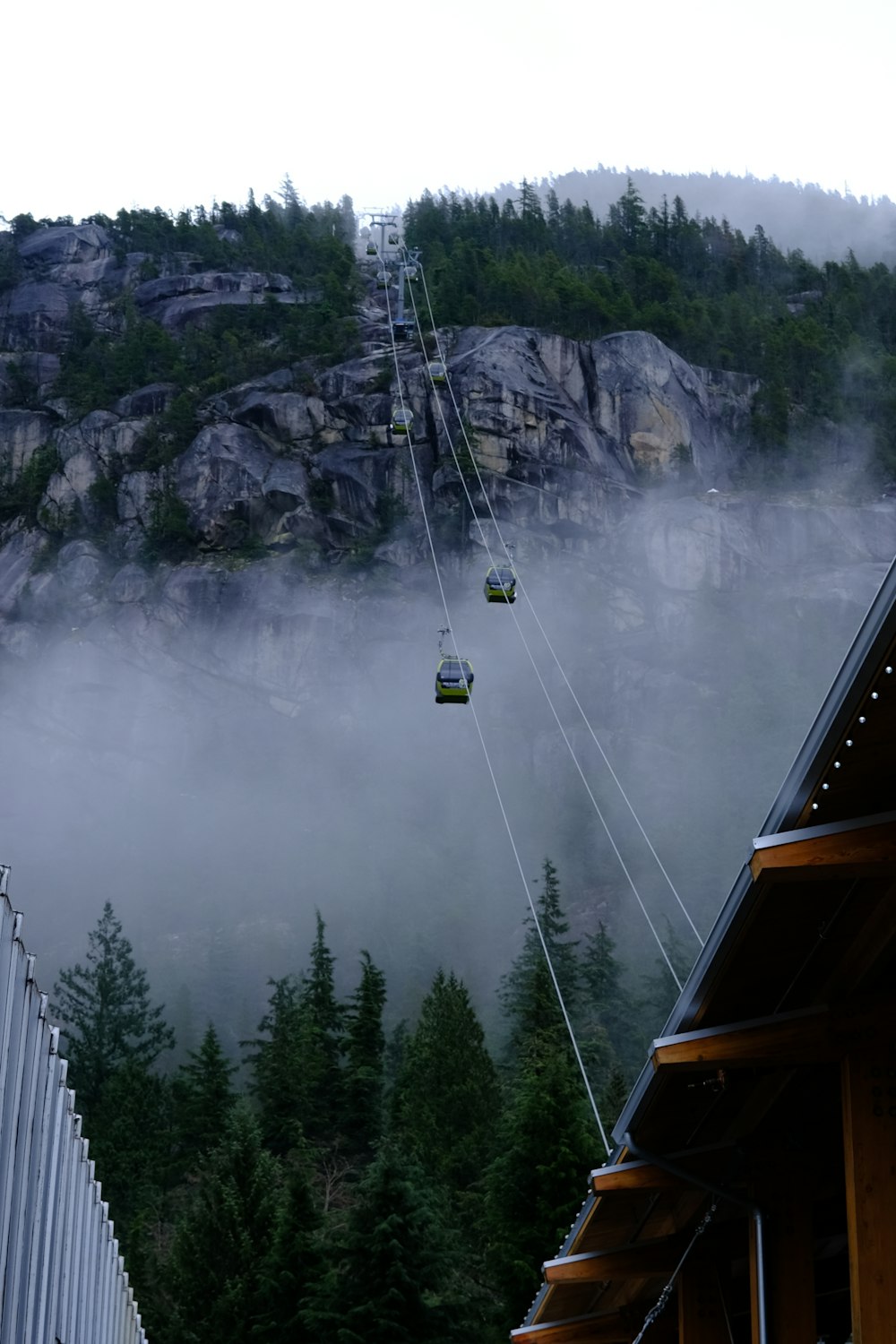 a ski lift going up the side of a mountain