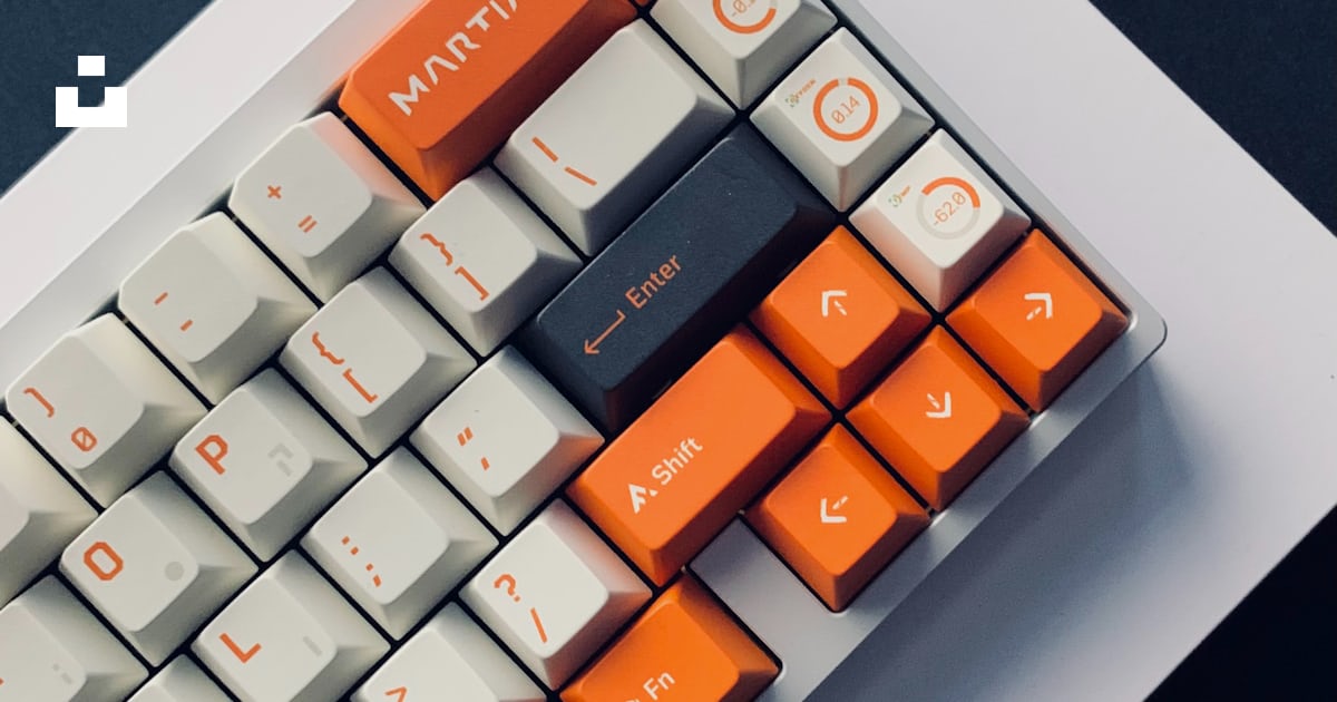 A close up of a computer keyboard with orange keys photo – Free Ho chi ...