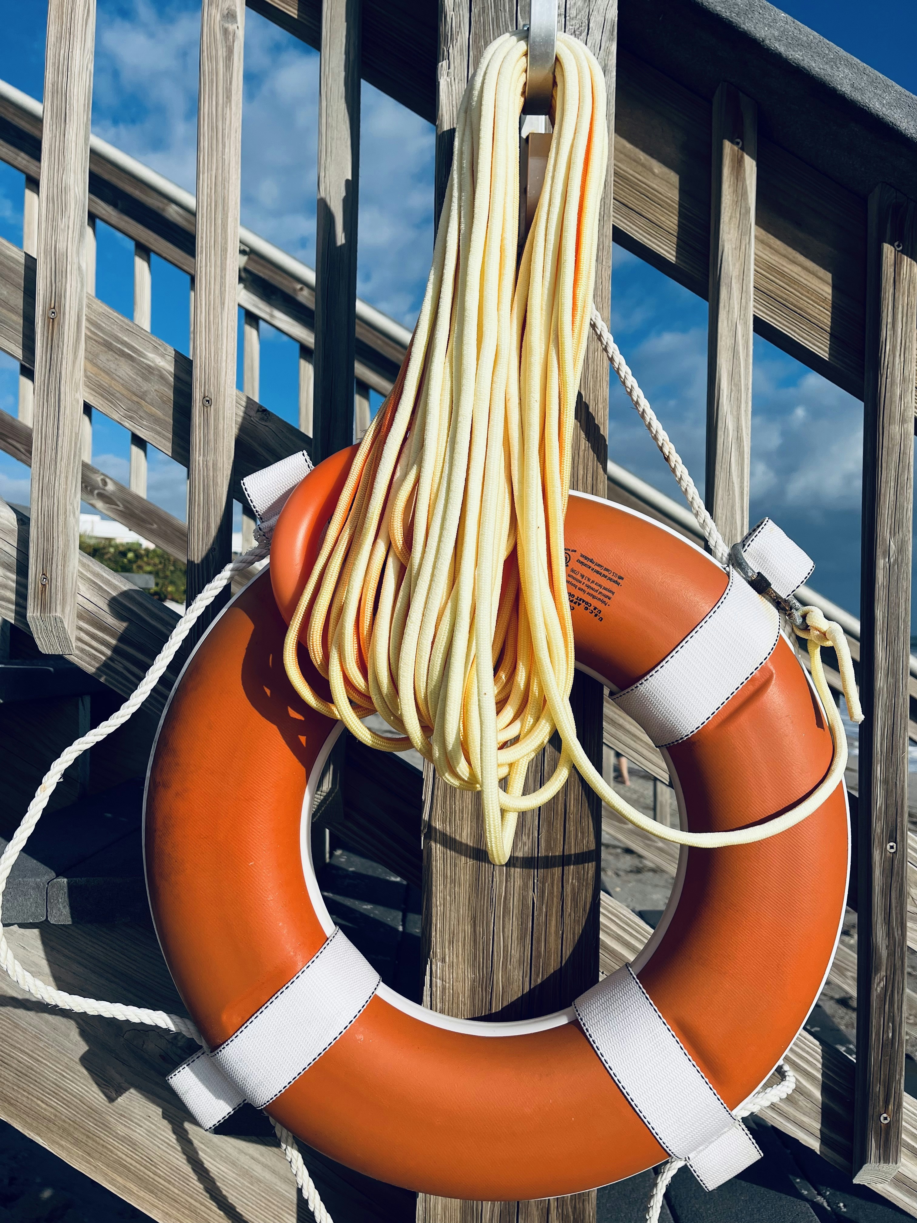 a life preserver hanging on a wooden dock