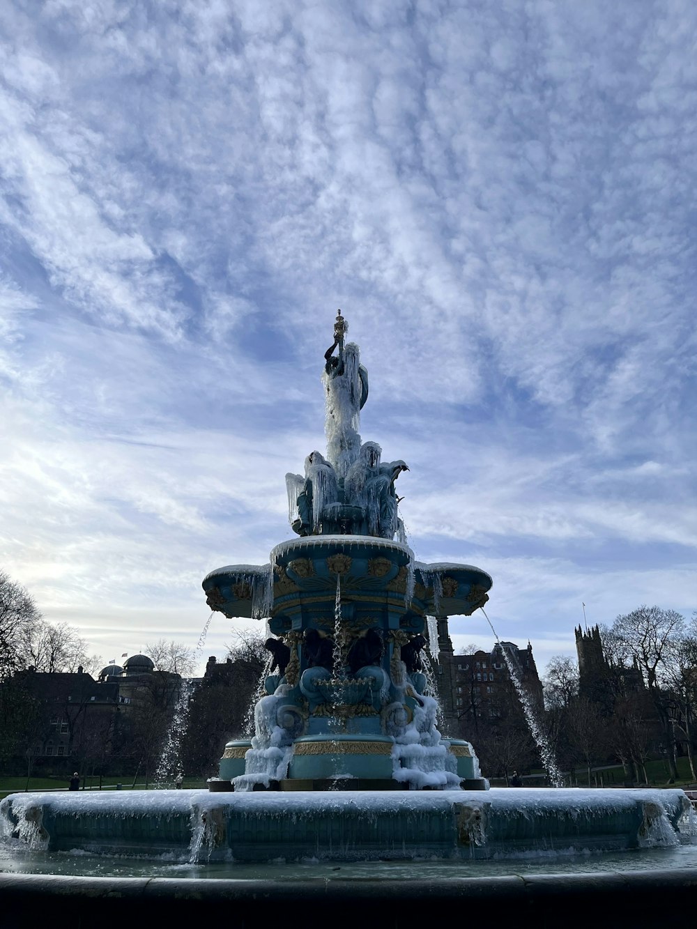 a water fountain with a statue on top of it