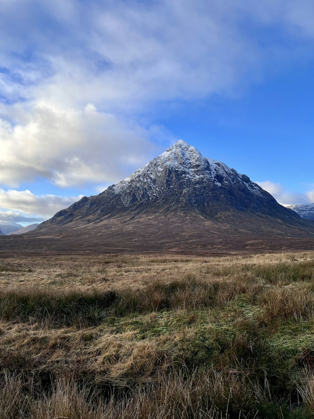 a large mountain with a snow covered top