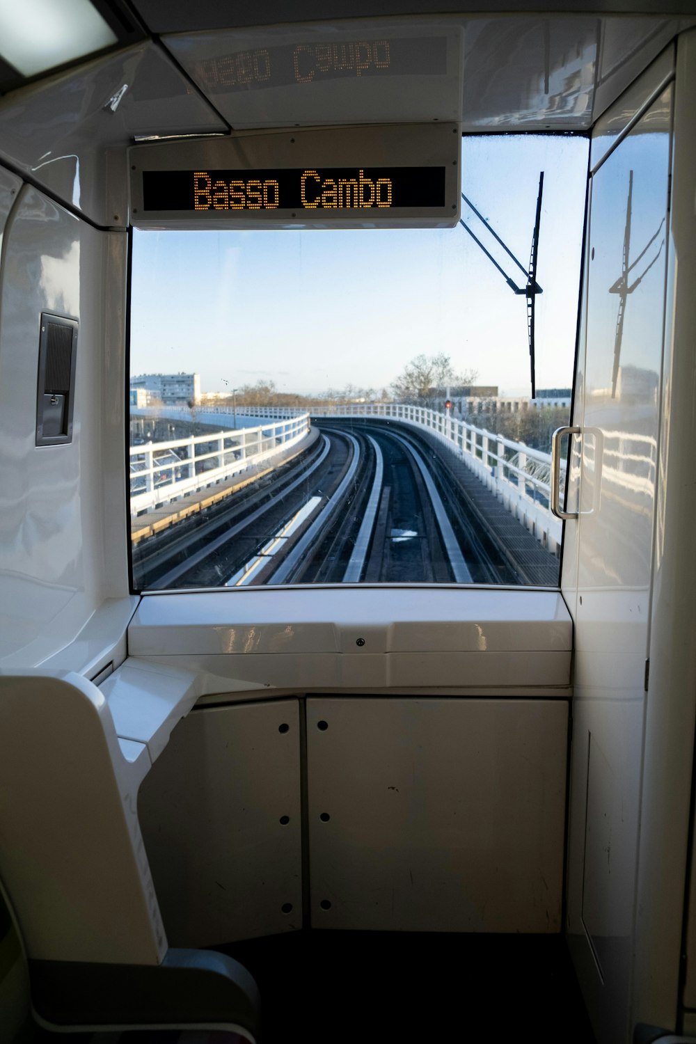 a view of a train track from inside a train car