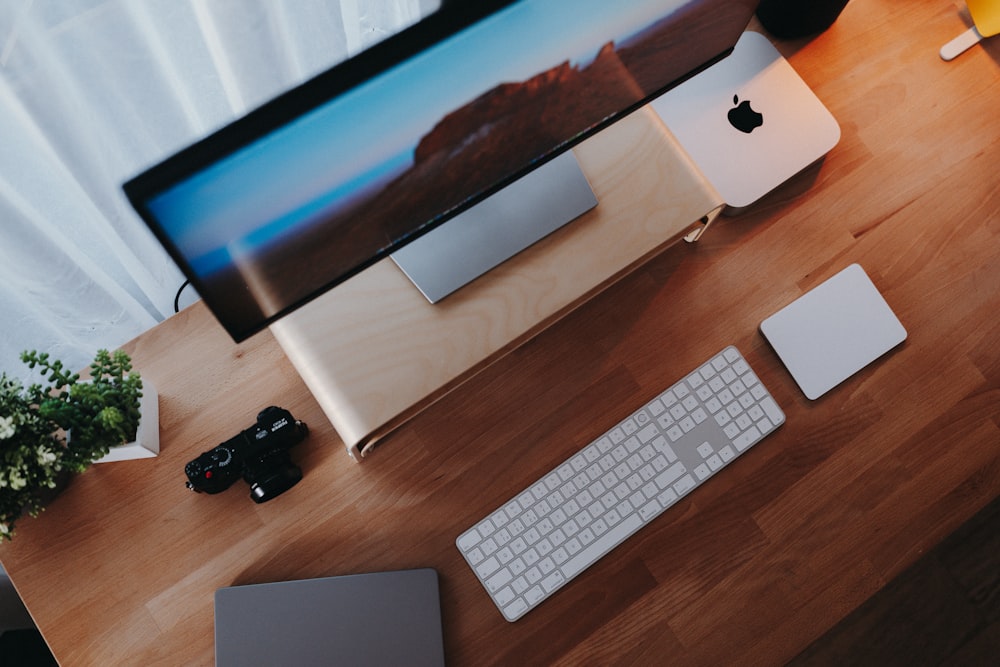 a desk with a keyboard, mouse, and monitor on it